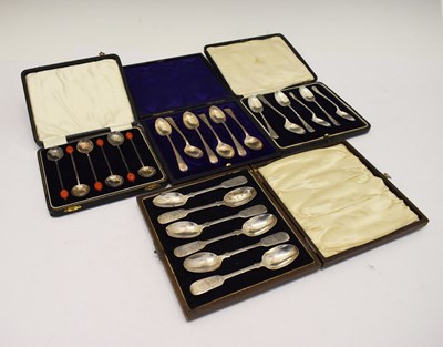 Lot 140 - Four sets of cased silver spoons