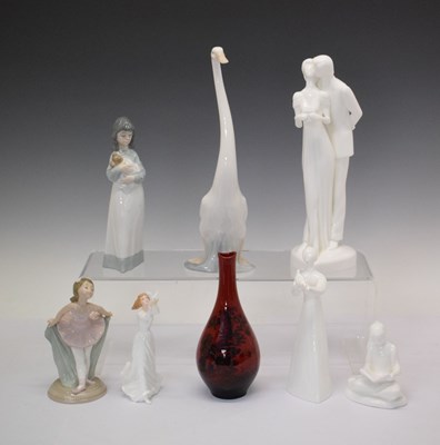 Lot 328 - Royal Doulton Flambé woodcut vase, group of Doulton and Nao figures