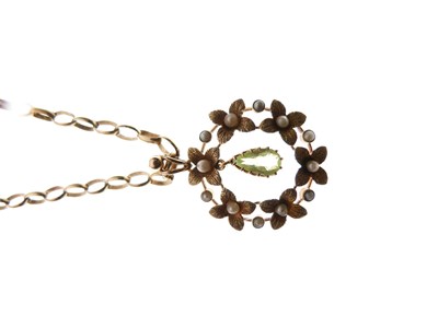 Lot 1 - Edwardian yellow metal, seed pearl and peridot pendant with 9ct chain