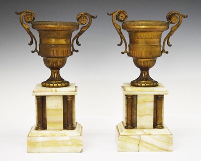 Lot 380 - Pair of late 19th Century French gilt metal and onyx urns