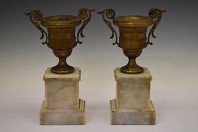 Lot 380 - Pair of late 19th Century French gilt metal and onyx urns