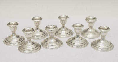 Lot 127 - Set of eight sterling silver low candlesticks