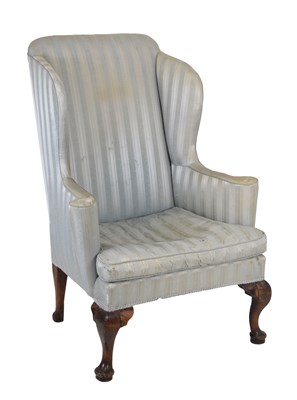 Lot 574 - Wing armchair, upholstered in striped blue silk