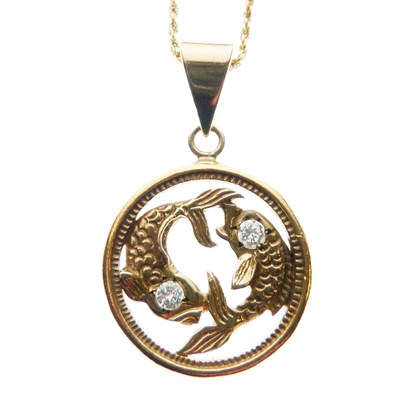 Lot 44 - High carat gold pendant inset two fish with diamond eyes, 18ct yellow metal chain