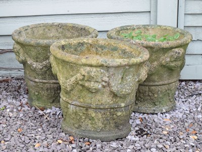 Lot 559 - Set of three composite stone garden planters