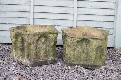 Lot 555 - Pair of composite stone pentagon garden planters with figural decoration