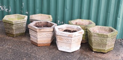 Lot 558 - Set of six hexagonal composite stone garden planters