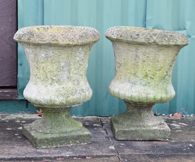 Lot 554 - Pair of composite stone garden pedestal planters