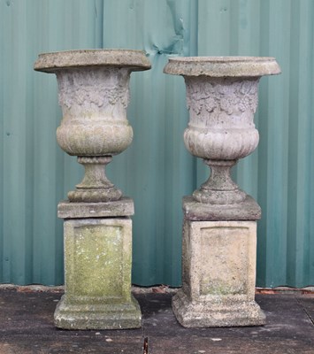 Lot 564 - Pair of composite stone garden pedestal planters on pedestal bases