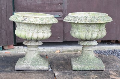 Lot 563 - Pair of composite stone garden pedestal planters