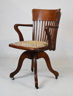 Lot 527 - Kenrick & Jefferson oak swivel chair