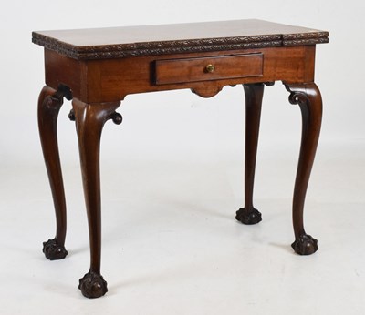 Lot 452 - Fold-over table, fitted one drawer and standing on claw and ball feet