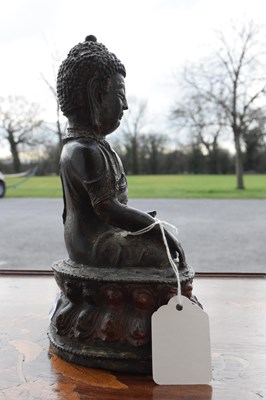 Lot 342 - Chinese or Tibetan bronze figure of the Buddha Shakyamuni