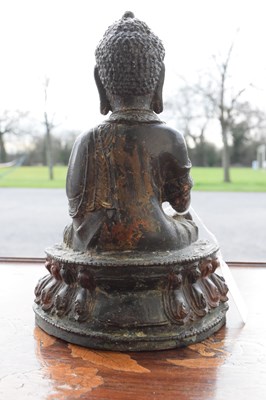 Lot 342 - Chinese or Tibetan bronze figure of the Buddha Shakyamuni