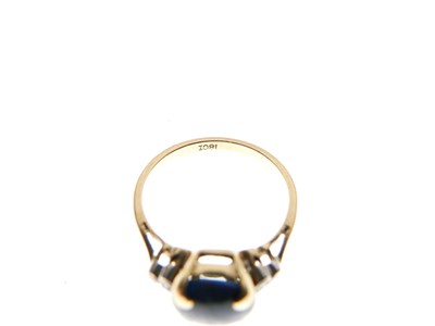 Lot 16 - Black opal single stone ring set three diamonds to each shoulder