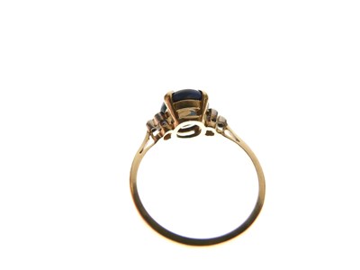 Lot 16 - Black opal single stone ring set three diamonds to each shoulder