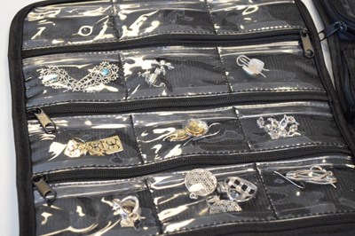 Lot 97 - Two black cloth pouches containing assorted silver and white metal jewellery