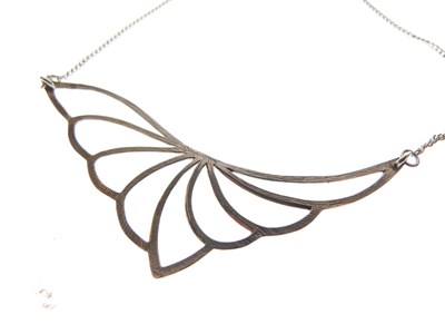 Lot 61 - Contemporary design silver pendant of open leaf/wing design