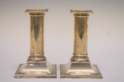 Lot 81 - Pair of George V silver candlesticks