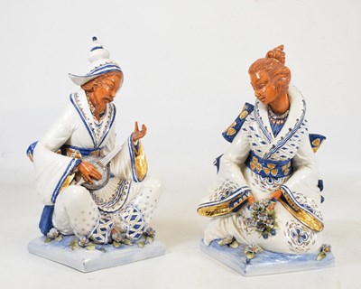 Lot 341 - Pair of polychrome painted and gilded ceramic figures