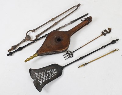 Lot 462 - Cast metal fire irons and bellows