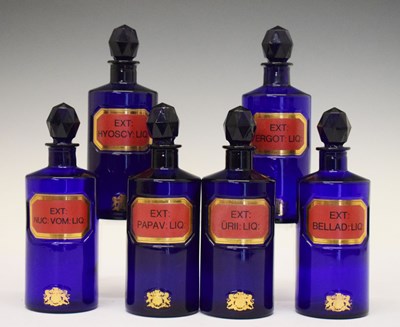 Lot 316 - Six 1970s blue glass apothecary bottles with stoppers