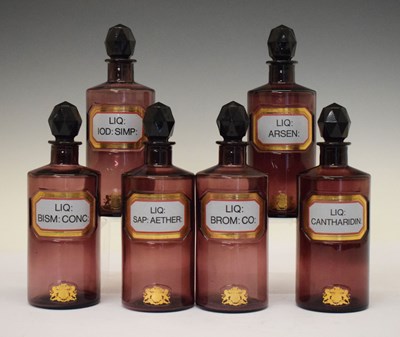 Lot 317 - Six 1970s amethyst glass apothecary bottles with stoppers