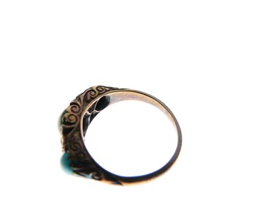 Lot 15 - Dress ring set three graduated turquoise cabochons and four old-cut diamonds