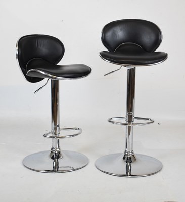 Lot 553 - Pair of black adjustable bar stools