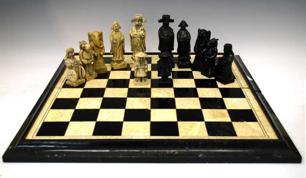 Lot 576 - Soapstone chess set and board