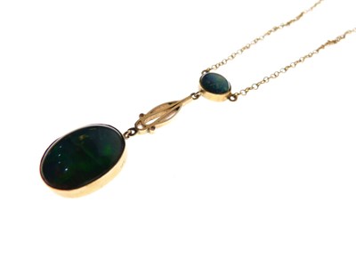 Lot 55 - 9ct yellow metal and black opal pendant with necklace