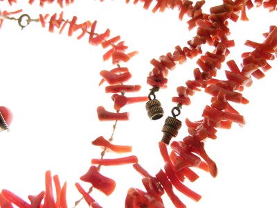 Lot 100 - Two fringed coral necklaces, coral bracelet, and pair of ear clips