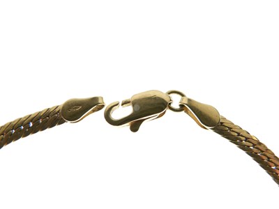 Lot 78 - Yellow metal flexible bracelet stamped '750'