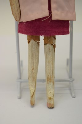 Lot 204 - Two wooden peg dolls