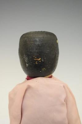 Lot 204 - Two wooden peg dolls