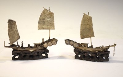 Lot 154 - Two Chinese white metal models of junks