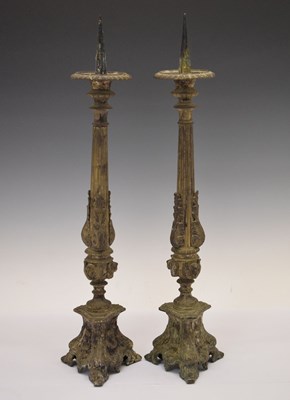 Lot 555 - Pair of plated pricket candlesticks