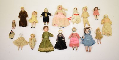 Lot 394 - Collection of antique dolls house dolls in a tin dolls trunk