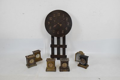 Lot 611 - American Arts & Crafts wall clock, plus musical alarm clocks