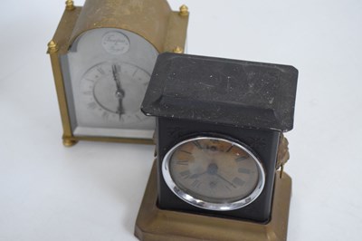 Lot 611 - American Arts & Crafts wall clock, plus musical alarm clocks