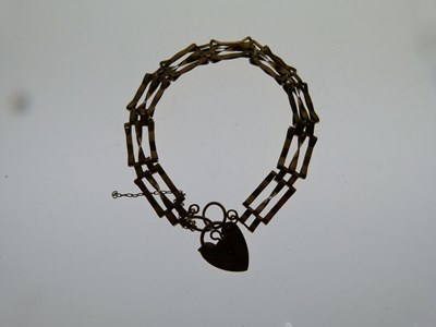 Lot 86 - 9ct gate-link bracelet with heart padlock