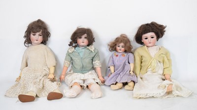 Lot 399 - Four bisque headed dolls