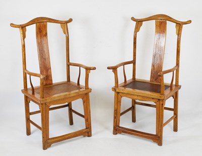 Lot 550 - Pair of Chinese elm arm chairs having cane seats