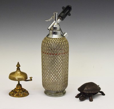 Lot 320 - Mid-century soda syphon, table bell and tortoise table bell