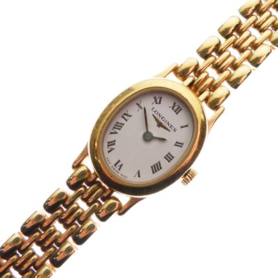 Lot 127 - Longines - Lady's gold plated bracelet watch