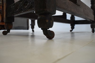 Lot 700 - Early 20th Century oak oval gateleg table, having carved border