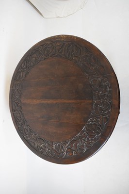 Lot 700 - Early 20th Century oak oval gateleg table, having carved border