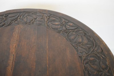 Lot 700 - Early 20th Century oak oval gateleg table, having carved border