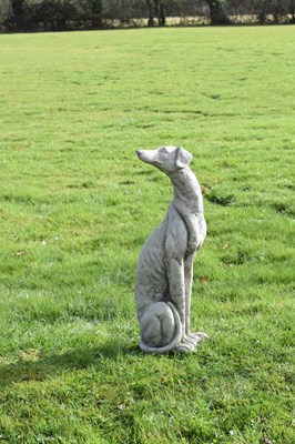 Lot 809 - Composition stone garden ornament of a whippet