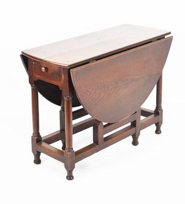 Lot 619 - Oak gateleg table